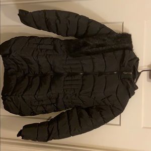 Women’s medium winter coat with attachable fur.